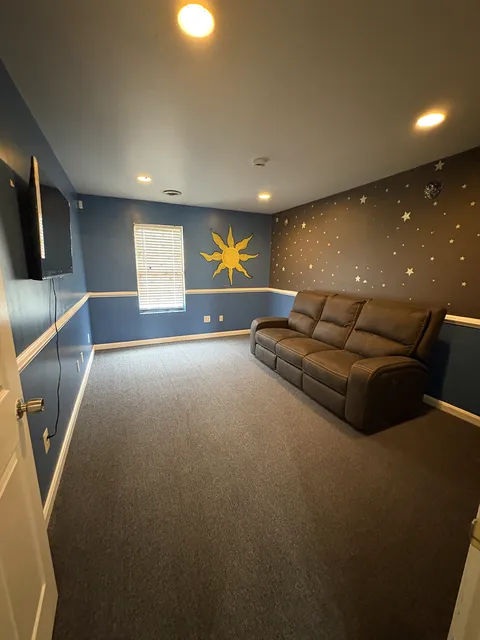 The cozy sensory lounge at Gregory & Friends with a starlit accent wall and comfortable seating for downtime
